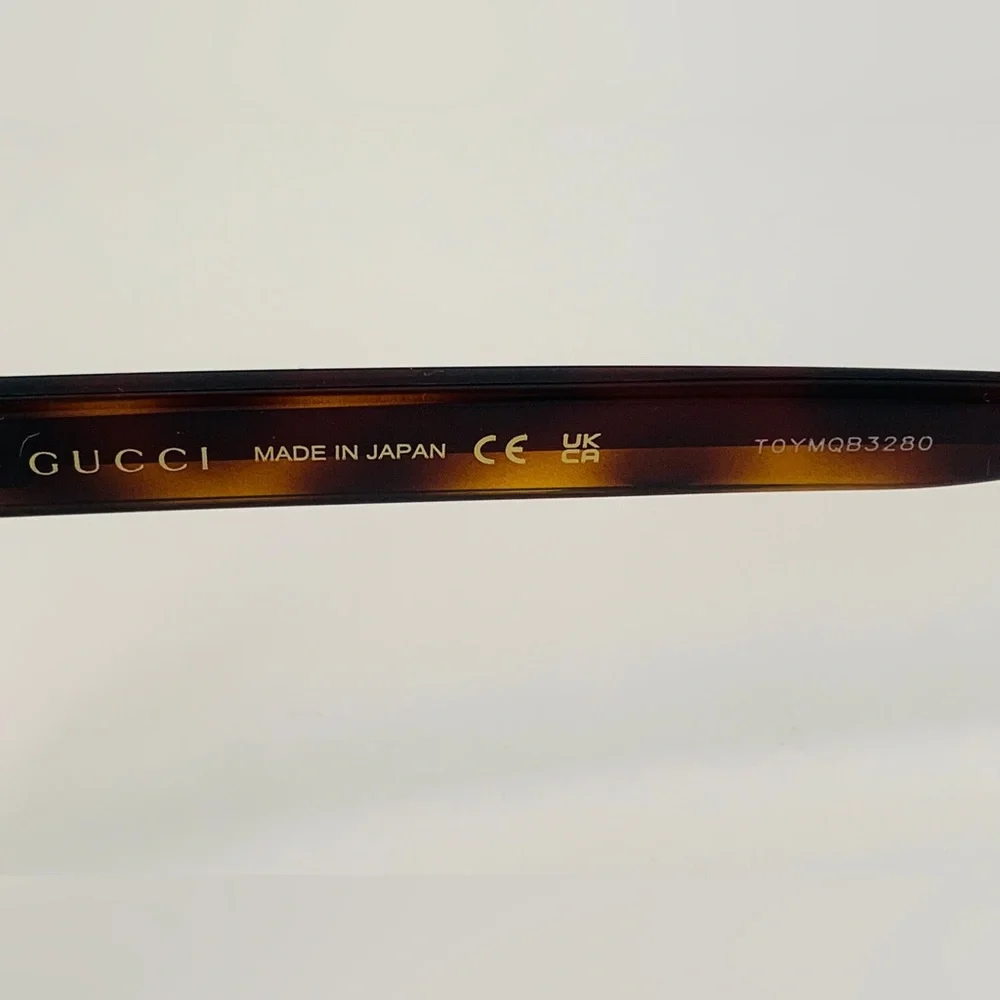 Gucci's GG0004ON features soft lines frames acetate front. Iconic web effect